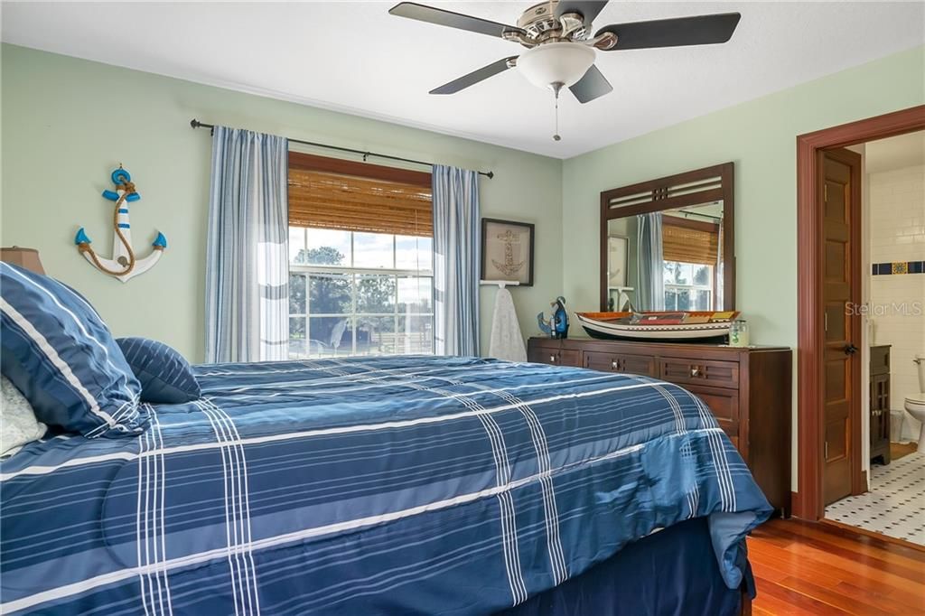 Bedroom 2 with Ensuite.  Nice space with wood floors and Ceiling fan