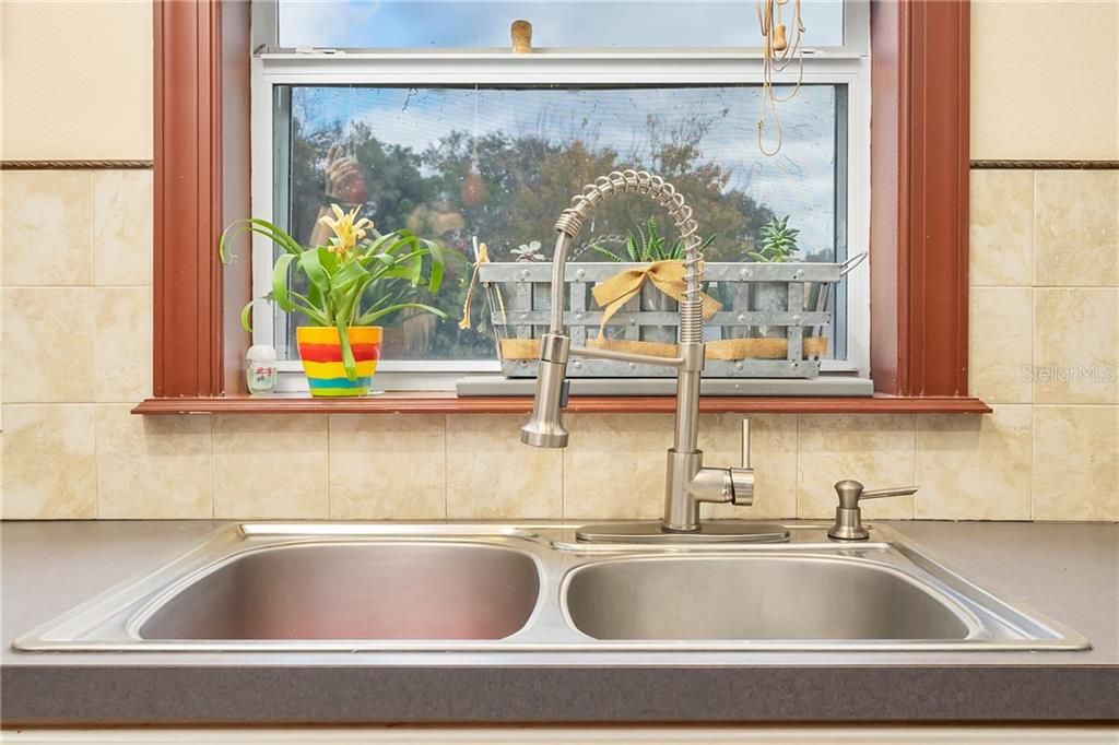 Love a sink looking out over the back yard.