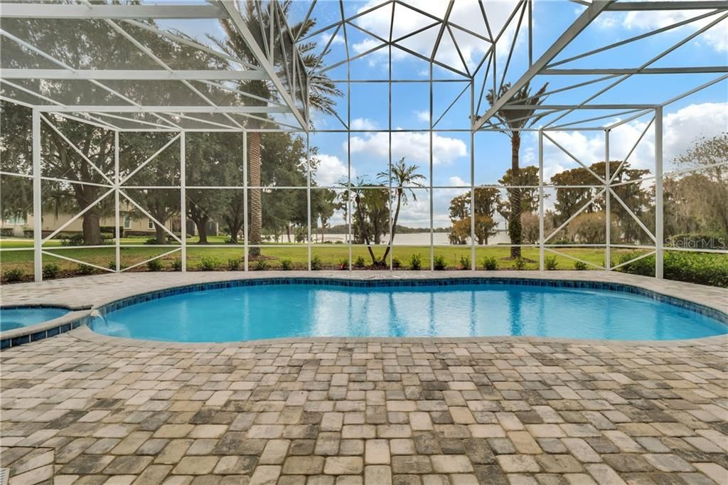 Expansive pool deck with gorgeous lake views