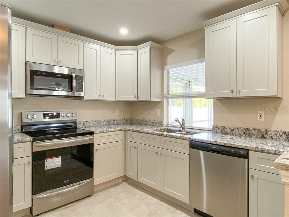 Renovated kitchen, new kitchen cabinets, countertops and appliances