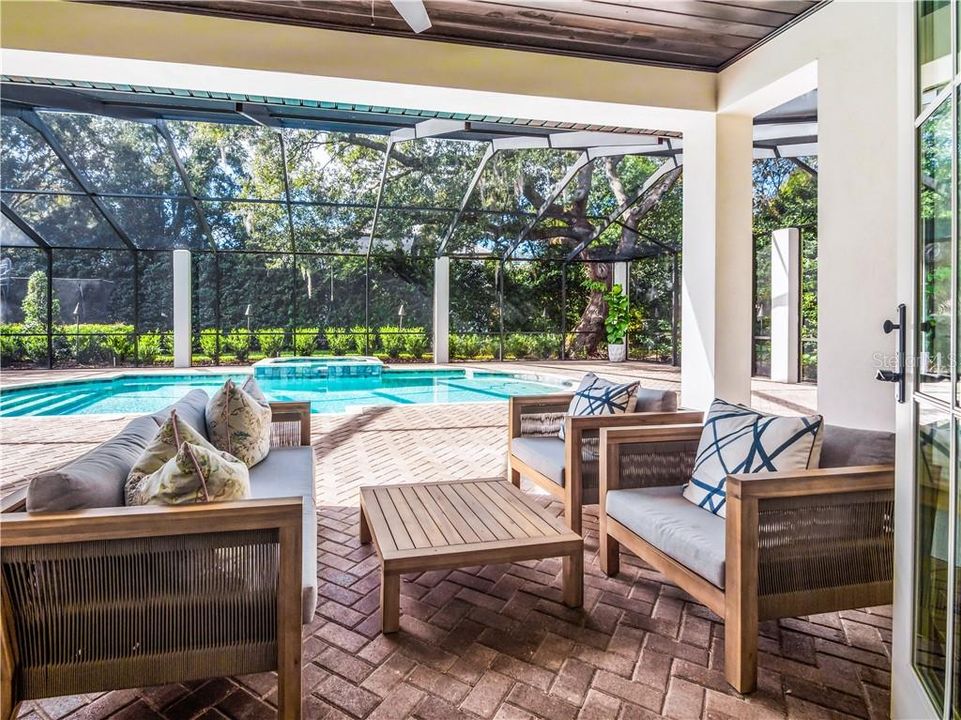 Covered Lanai, opening to the caged Heated Pool and Spa