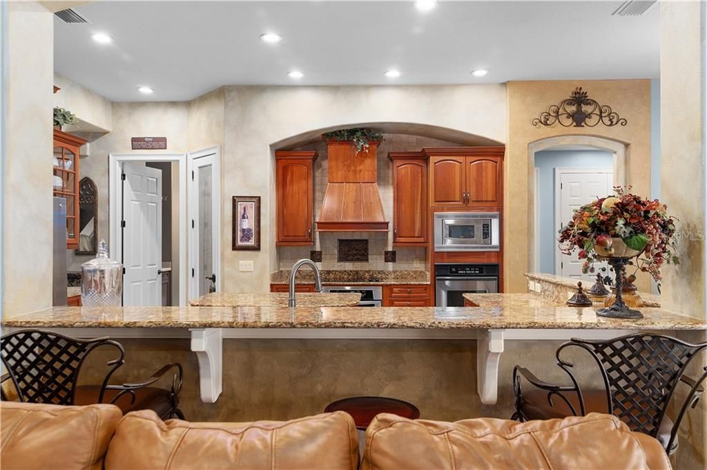 Great room opens to the spacious kitchen with oversized breakfast bar.