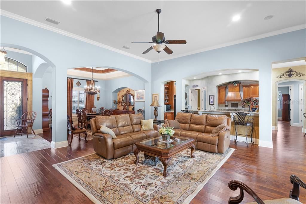 Combined dining, kitchen & great room features engineered wood floors and 12' to 14' ceilings.