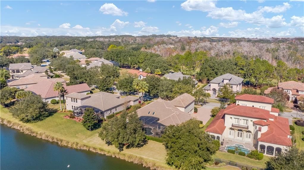 Coveted location in the Estate Section of custom homes on the Las Colinas pond.  Property is to the left of the red roof two story home.