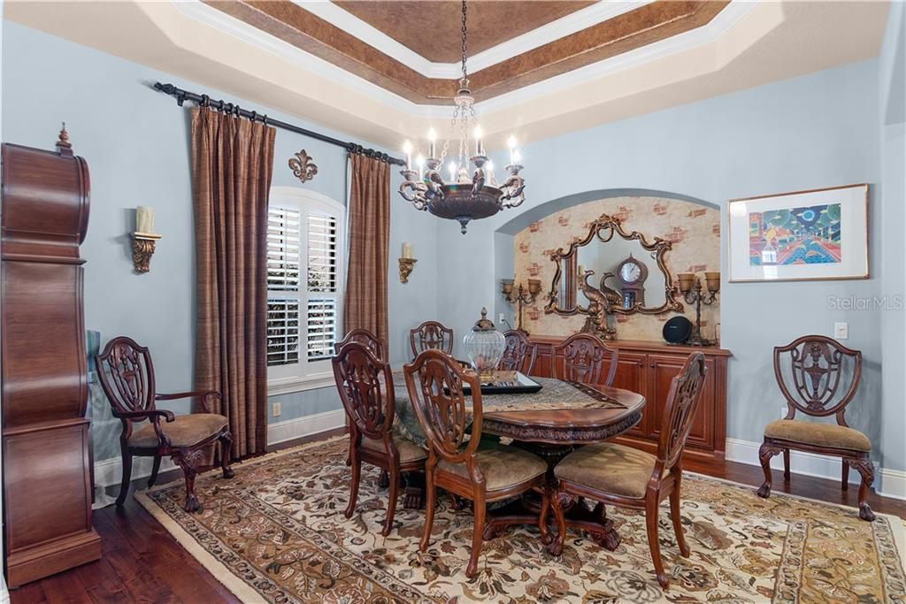 Professionally decorated with faux painted tray ceiling, niche and engineered wood floors.