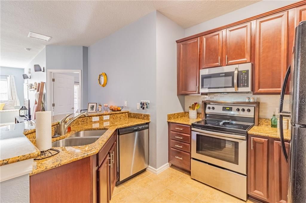 Updated kitchen is open to living and dining areas