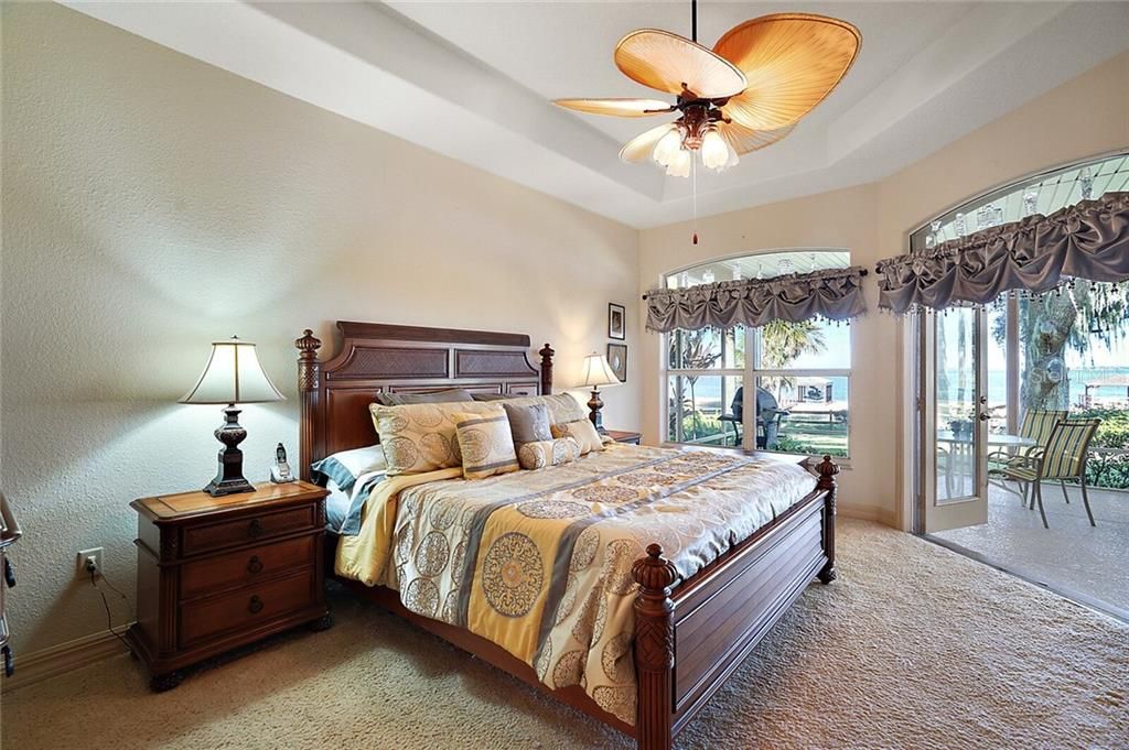 Master Bedroom with Tray Ceiling and French Doors Leading to the Lanai
