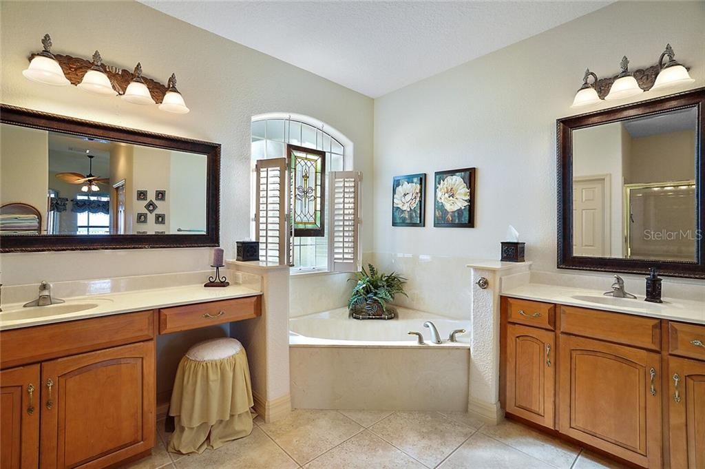 Master Bathroom with Dual Sinks and Vanities