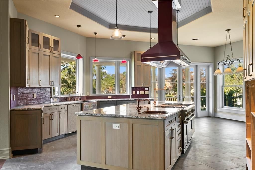 The kitchen is quite large with an oversized island and plenty of natural light