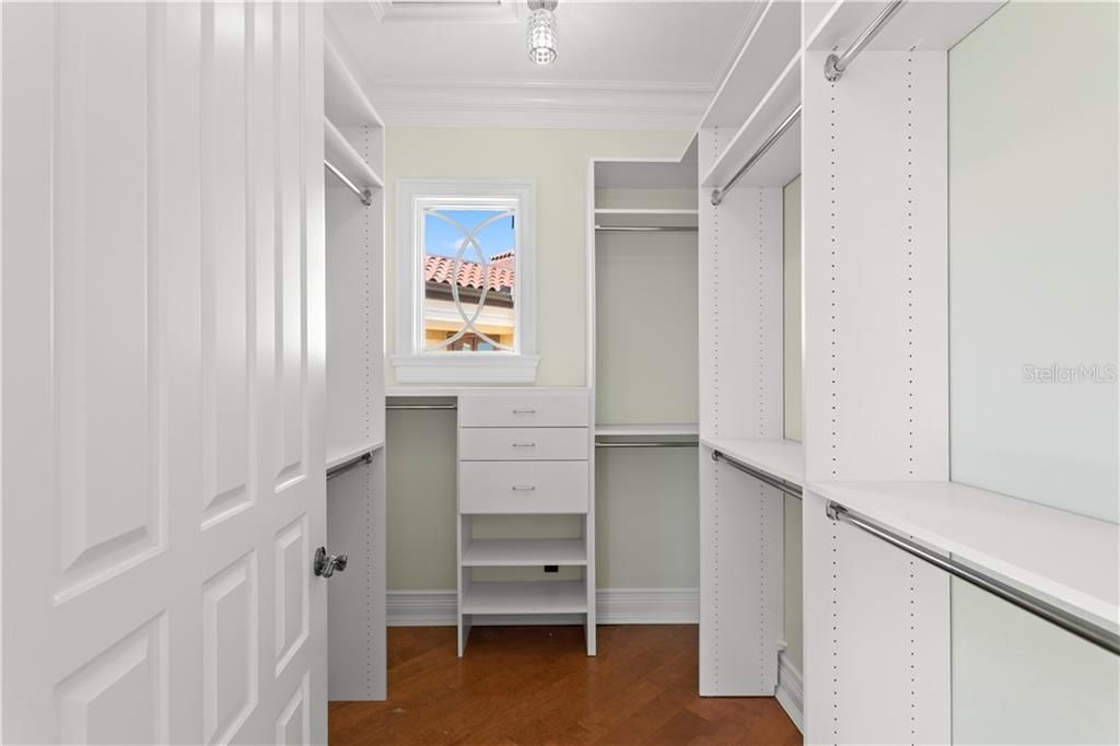 The upper level south end bedroom has a walk in closet with a window for natural light