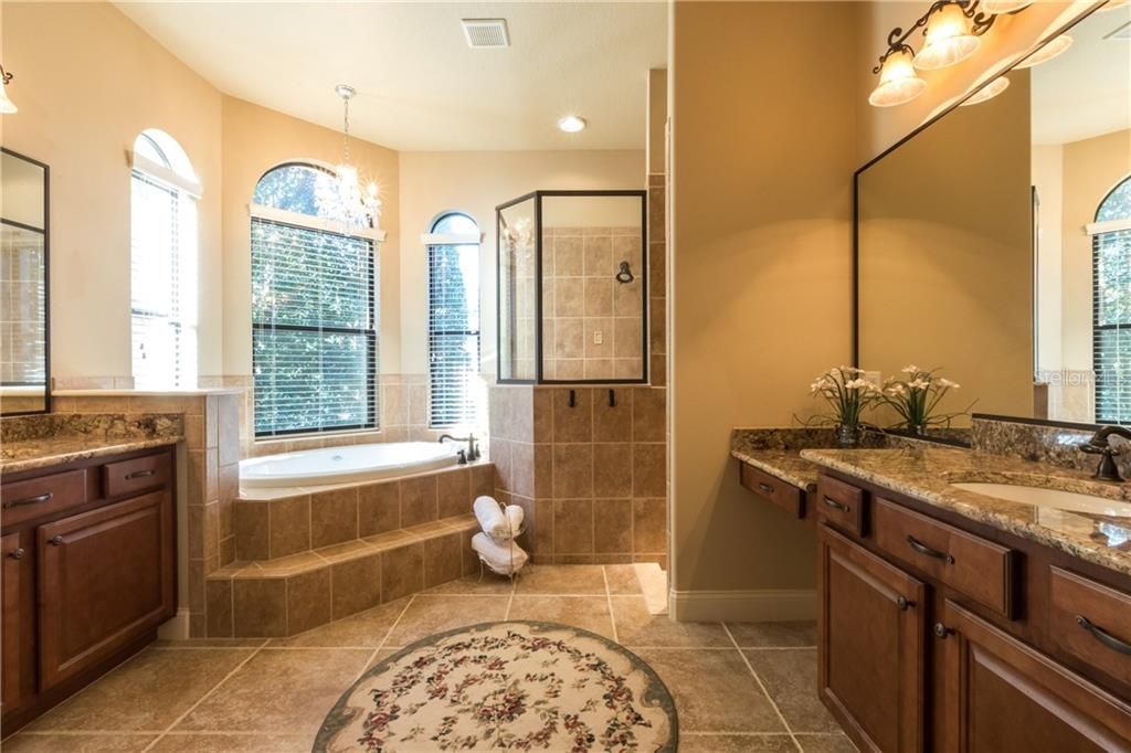 Jacuzzi Tub, Double Head Shower, Water Closet, Italian Granite Countertops, 2 Separate sinks, Cherry Wood Cabinets, 1- Outlet under each sink inside cabinet.