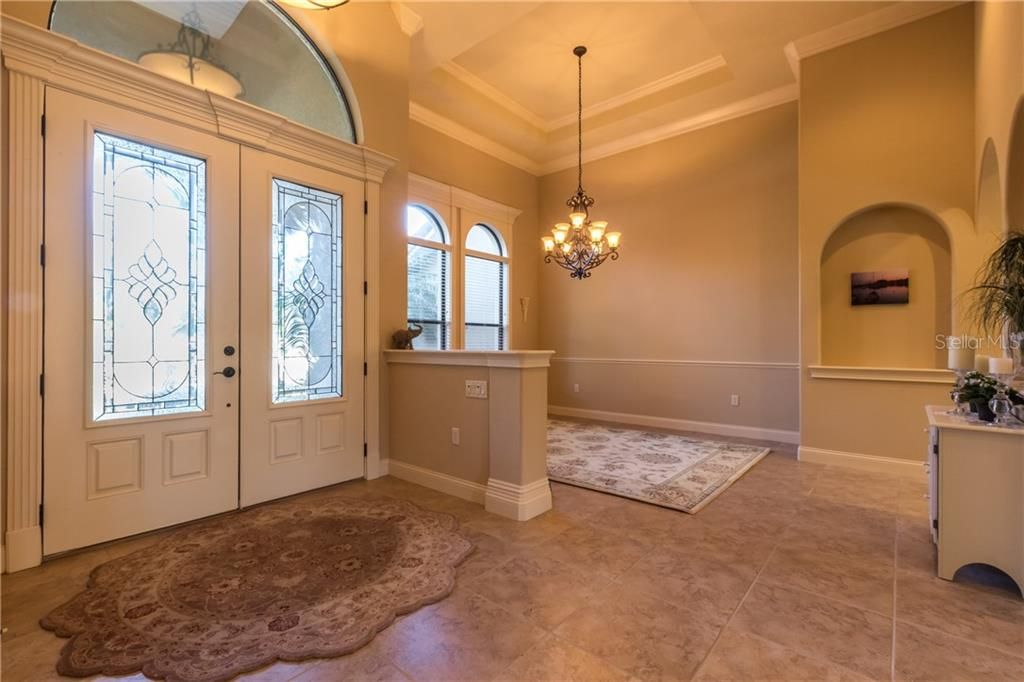 Double Entry door with Stain Glass, Step Up Ceiling and Decorative Niche with Arch.