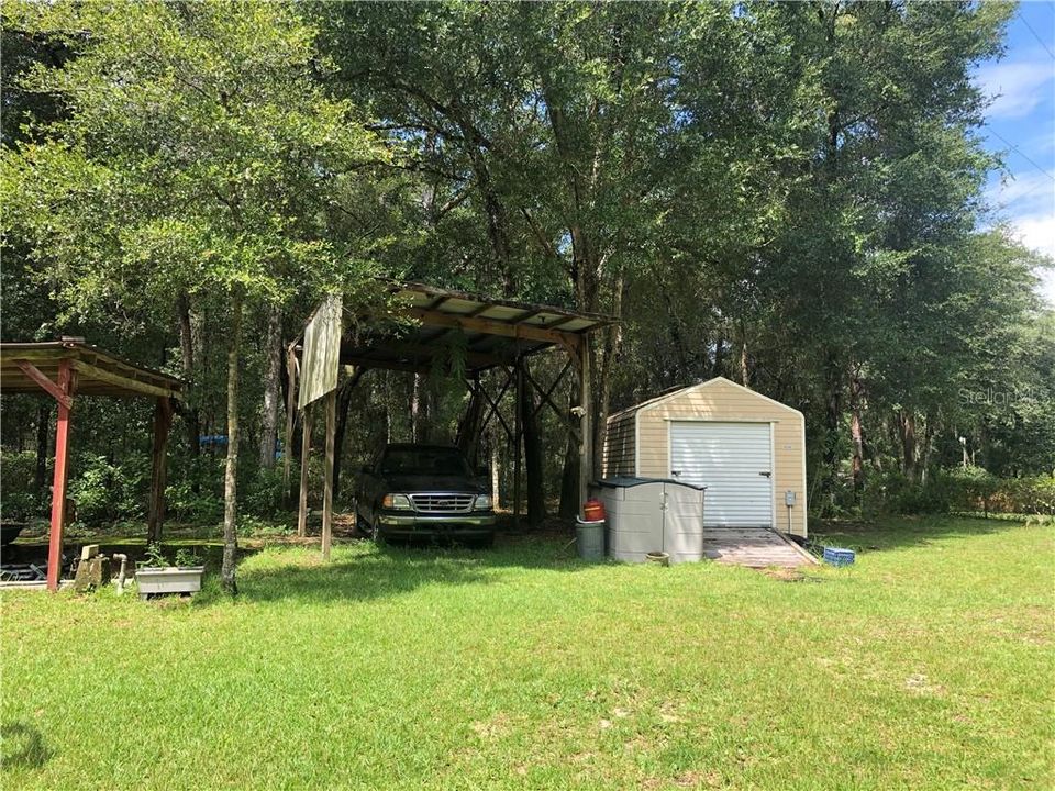 Shed / Workshop with roll up door and ramp entry.