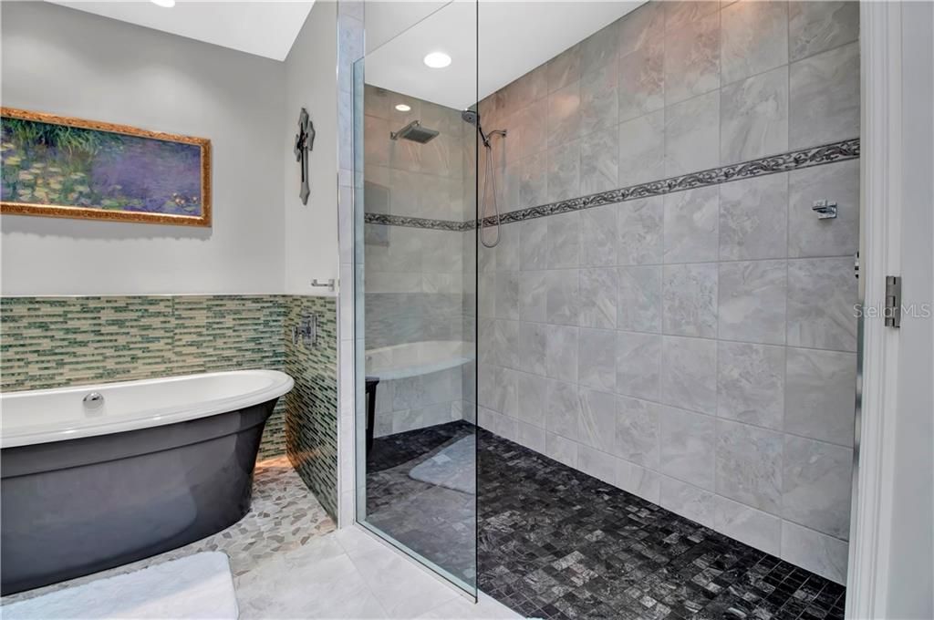 Amazing oversized walk in shower and tub that fills with water from an over head spout