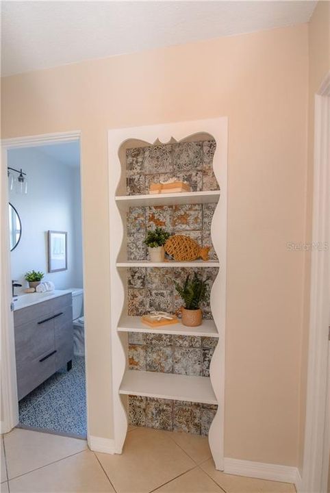 Decorative shelf outside of the guest bathroom