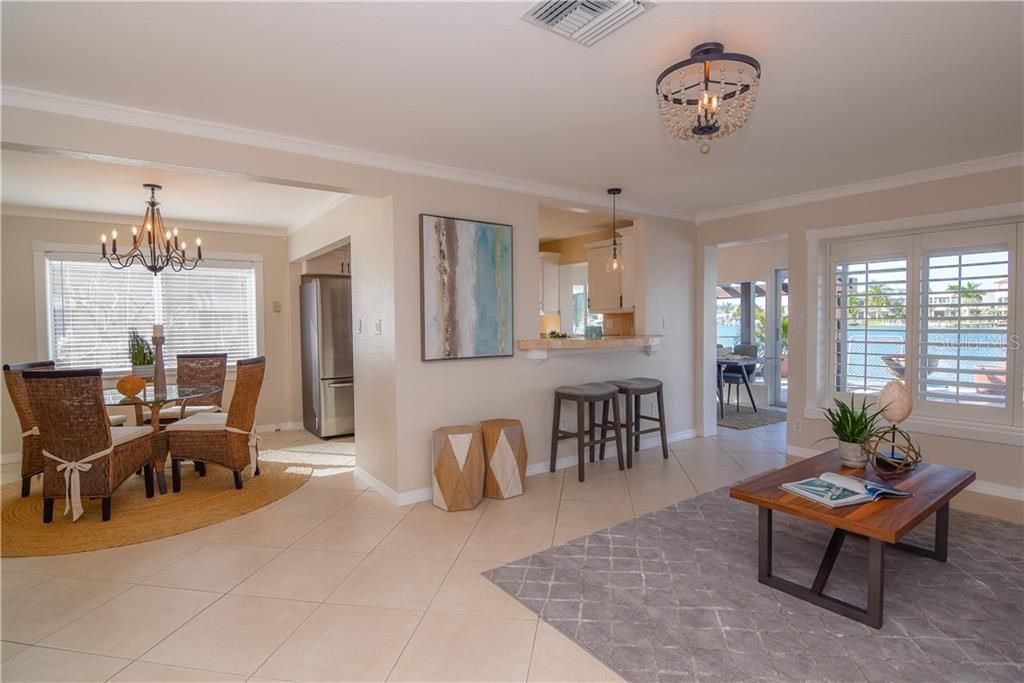Living room with views of Boca Ciega Bay & the dining room