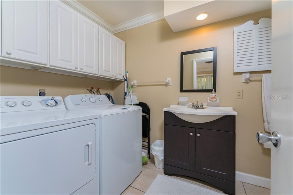 Full ensuite bathroom with the washer and dryer in the 2 bedroom unit.