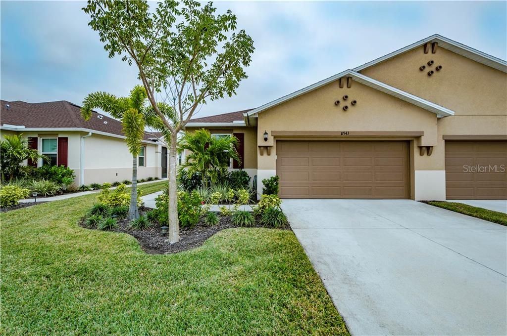 2 car garage and lush curb appeal