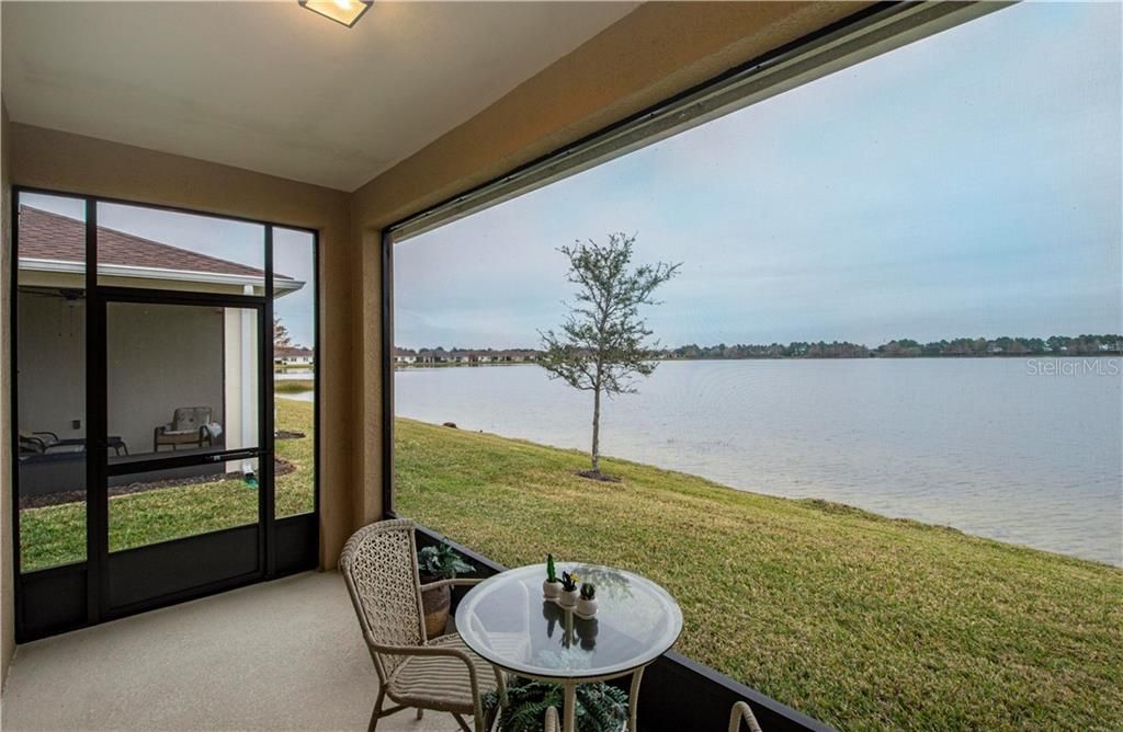 Rear screened in patio overlooking the lake