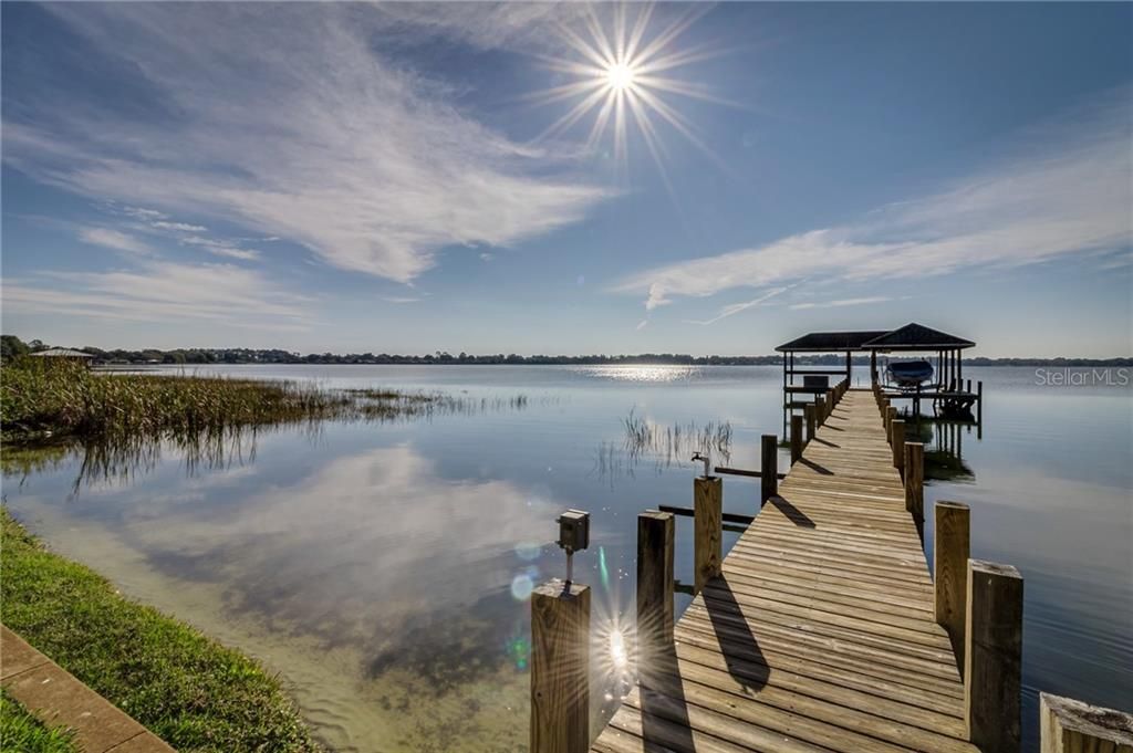 PRIVATE boat dock and covered lift with water & electric. Seating to watch the gorgeous Sunrises & Sunsets