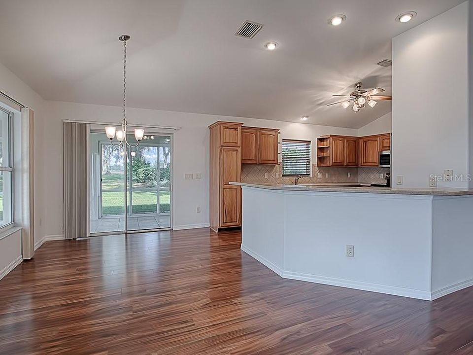 ACRYLIC ENCLOSED L-SHAPED LANAI OFF OF THE CASUAL DINING AREA OFF OF THE KITCHEN!