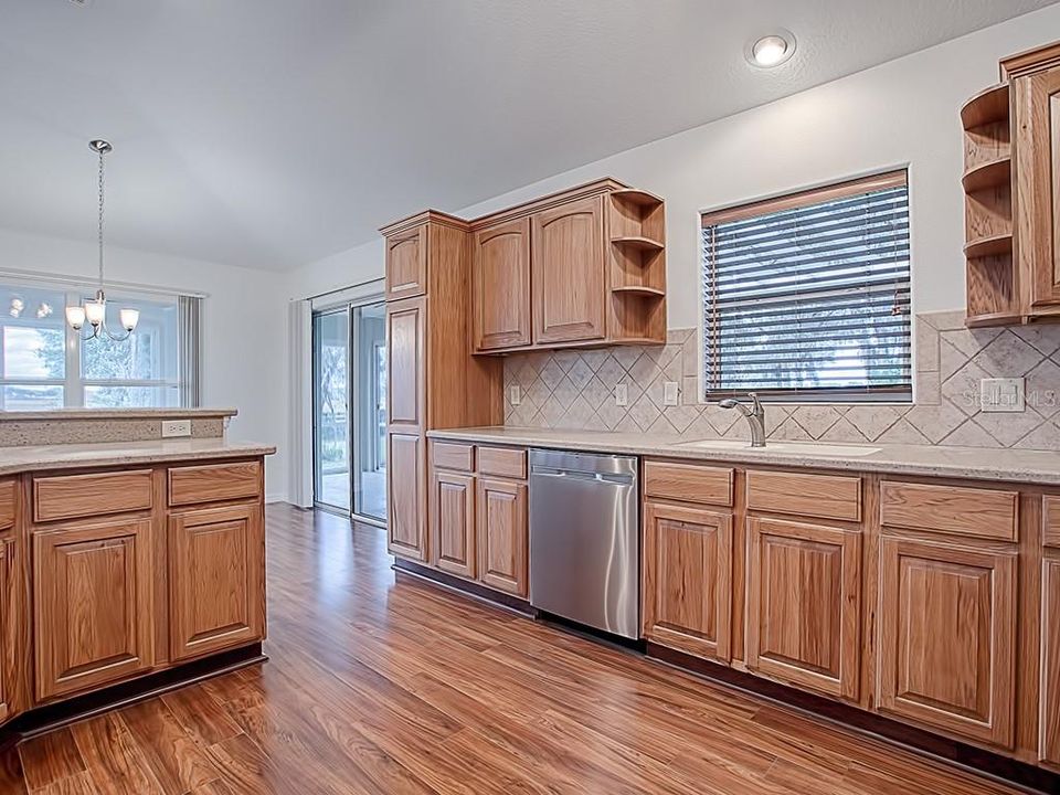 LOVE THE WINDOW IN THE KITCHEN WHICH LOOKS OUT TOWARDS THE GOLF COURSE IN THE DISTANCE! PANTRY WITH PULL OUT SHELVES!