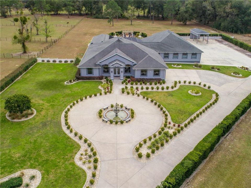 Beautiful Resort-like Estate with 9,160 square feet all under one roof. Nestled at the end of a quiet street in the cul-de-sac with privacy shrubs, and an elegant 4-tier water fountain with benches grace the center of the circular driveway.