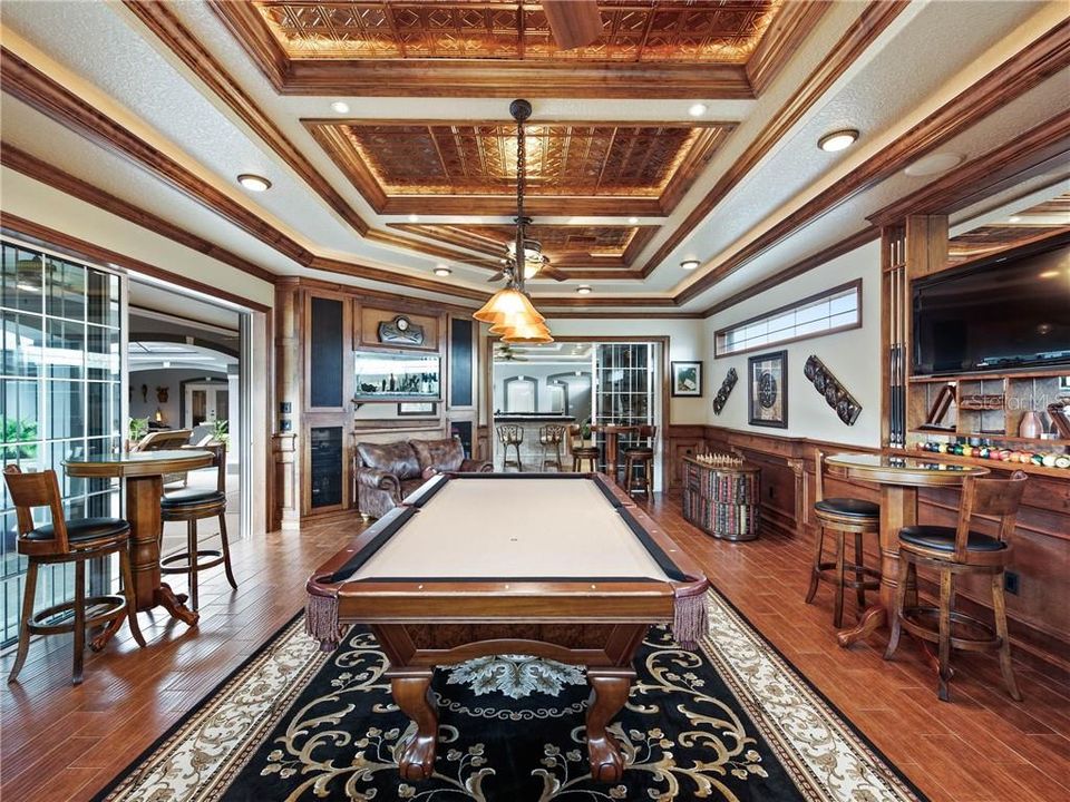 State-of-the-art Billiards and Game room located just off of the Outdoor Hibachi Kitchen. 9' wide sliding glass doors open and make this space open to the Covered Lanai.