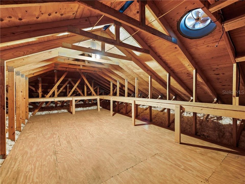 One of the two unfinished Attic storage spaces with attic fans over the 4-Bay Garage