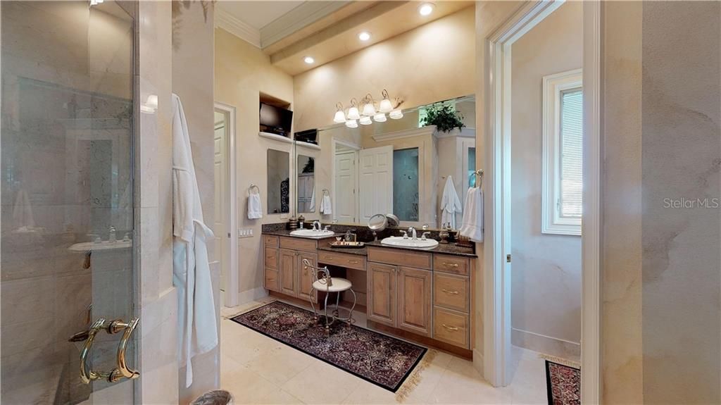 Large ensuite master bath, two sinks, vanity, separate toilet room, double shower and Jacuzzi tub