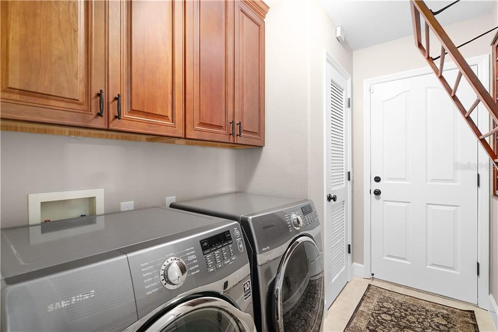 Laundry Room with Upgraded Cabinets and Closet