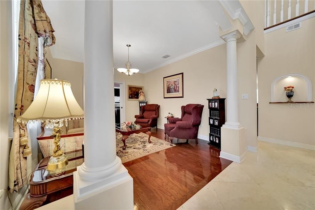 Formal Living Room opens to the Family room with double French Doors