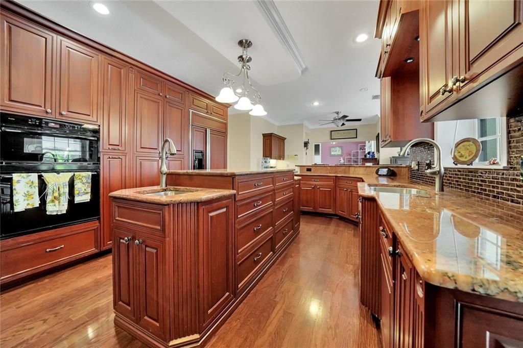 Custom cabinets, double oven, glass cooktop