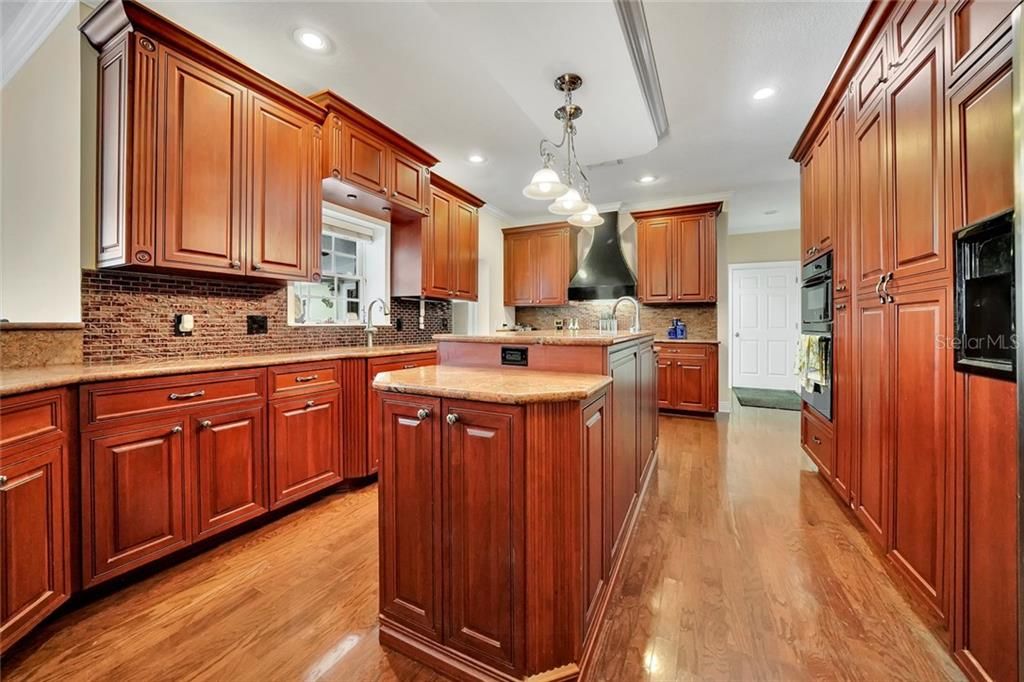 Gourmet Kitchen with island, dual sinks, built in cabinet walk in Pantry