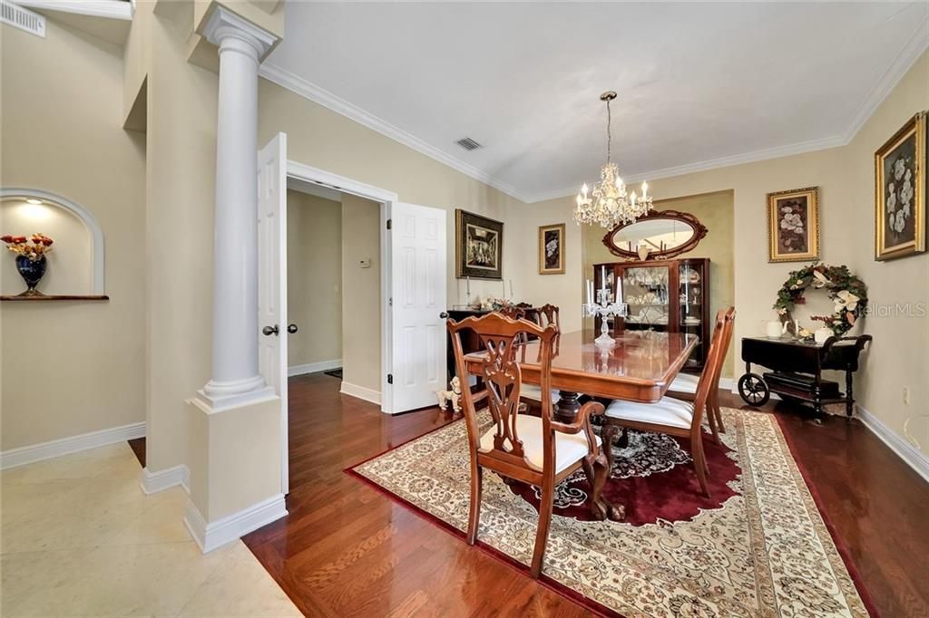 Formal Dining Room with access through double French Doors to the Gourmet Kitchen