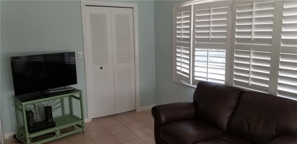 Florida Room with ceramic tile and Plantation Shutters....