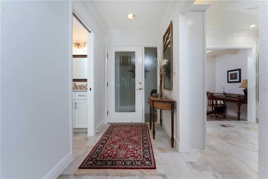 Outside of this front door entry, is a charming enclosed porch area with a screen door allowing wonderful cross ventilation