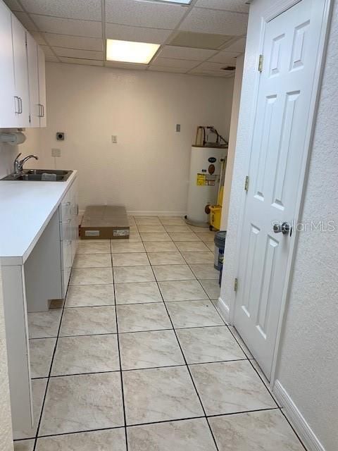 Kitchen complete with washer/dryer hookup. Area for table and chairs. Break room.