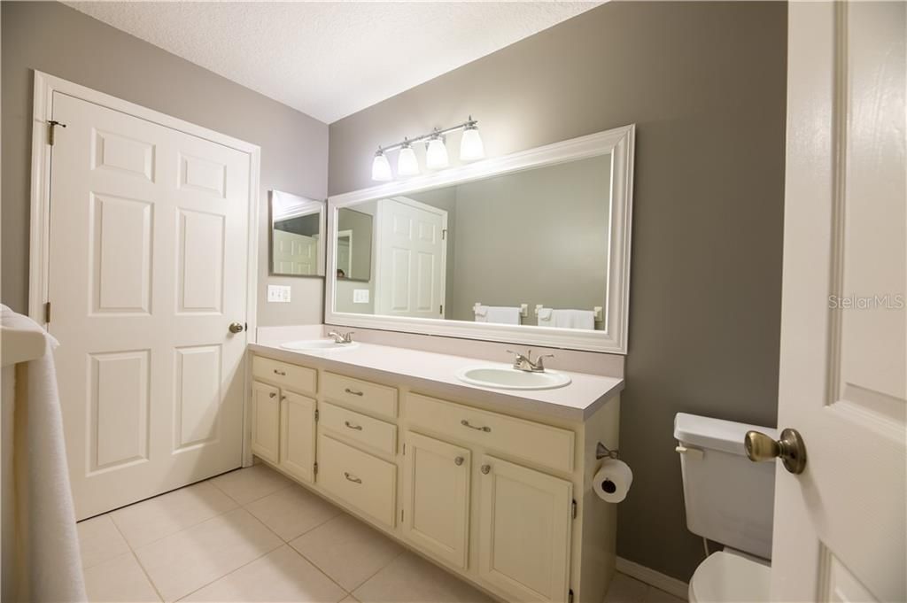 Upstairs bathroom features double sink