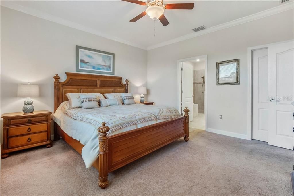 Master Bedroom Suite is adorned with Crown Molding Trim