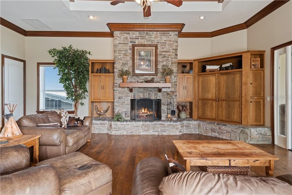 Impressive stone wood-burning fireplace in the Family room, between the Kitchen and Florida room.