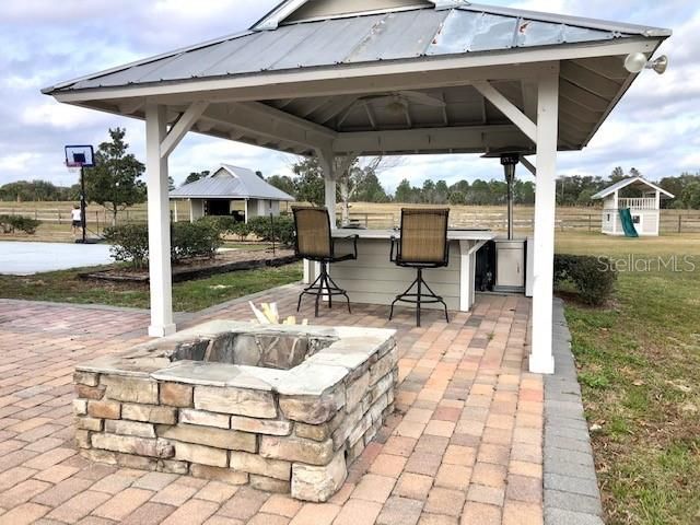 Pavered Area for BBQ and FIREPIT to PLAY safely and distance yourself in sunny Florida.