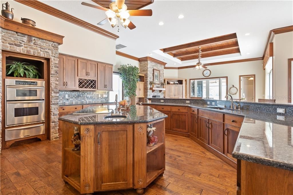 Center prep sink, wine shelf. Amazing cabinet, work and counter space!