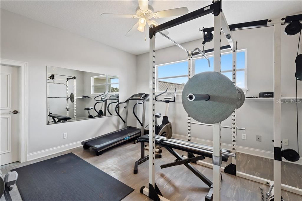 A total of 5 BR's, Upstairs this is the third of 3 Bedrooms, currently used as a home gym.