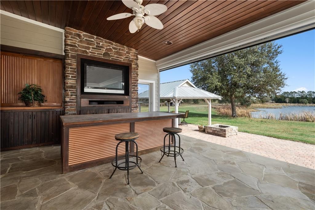 Enjoy the Outdoor Bar with electric screen panels all year. Be outdoors while watching Races, the Game, or movies.