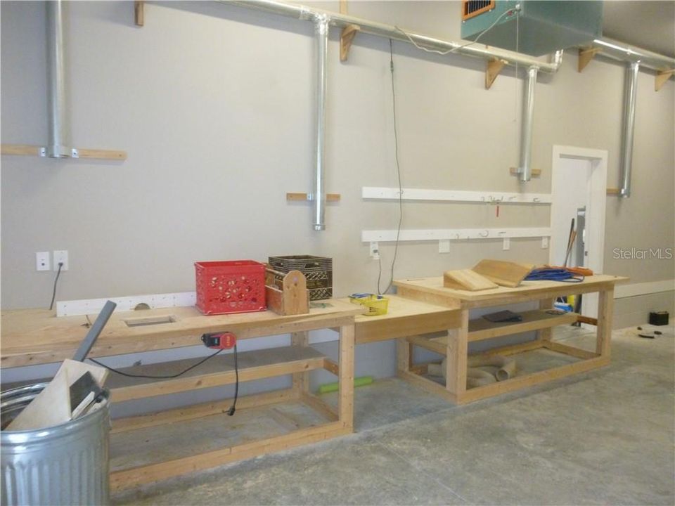 GUEST HOME WORKSHOP/BAY WITH WORKBENCHES.