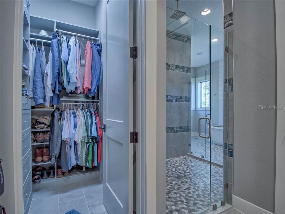 MASTER BATHROOM (HIS) CLOSET AND PRIVATE ENTRANCE TO THE SHOWER