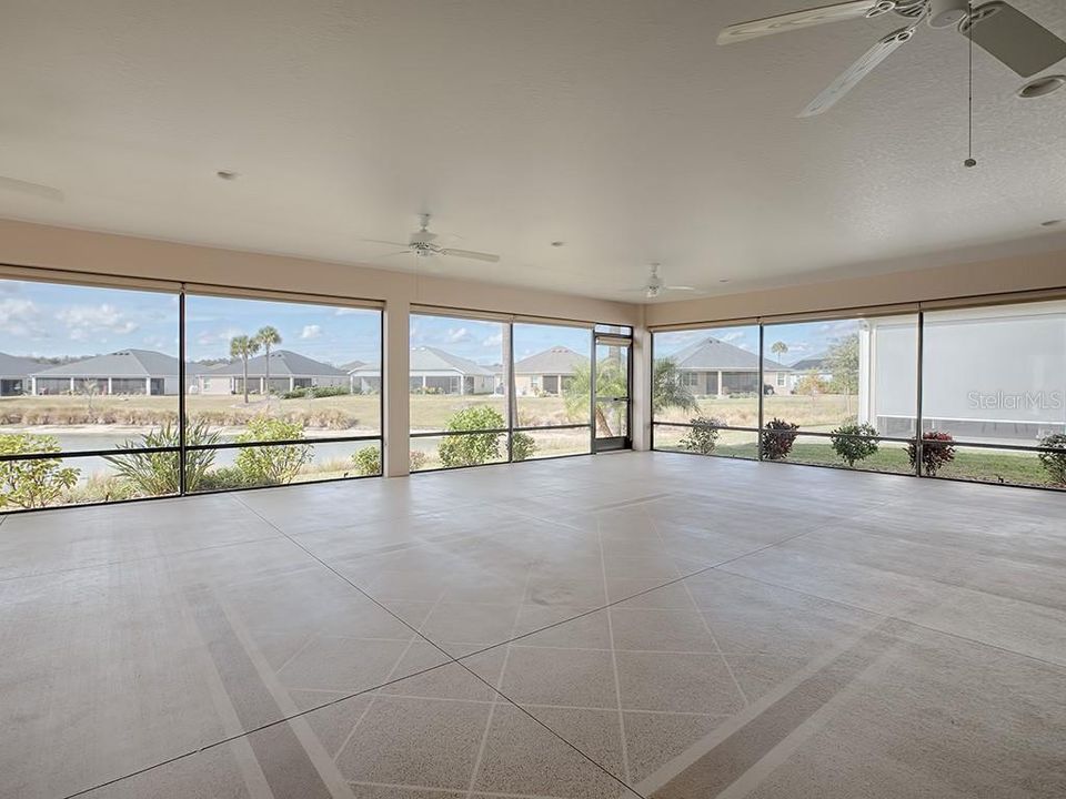 902 SQ. FT. LANAI WITH PAINTED FLOORING AND SUN SHADES!