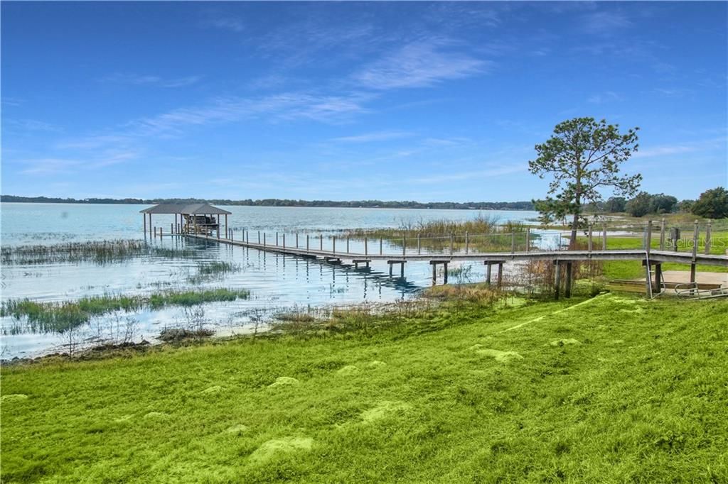 Dock and boat house with electric lift built 2020. Electric and water ran to boat house.