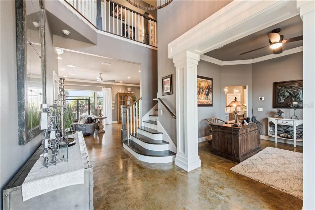 From front entry looking into office and great room. Notice the loft on second story overlooking entryway.